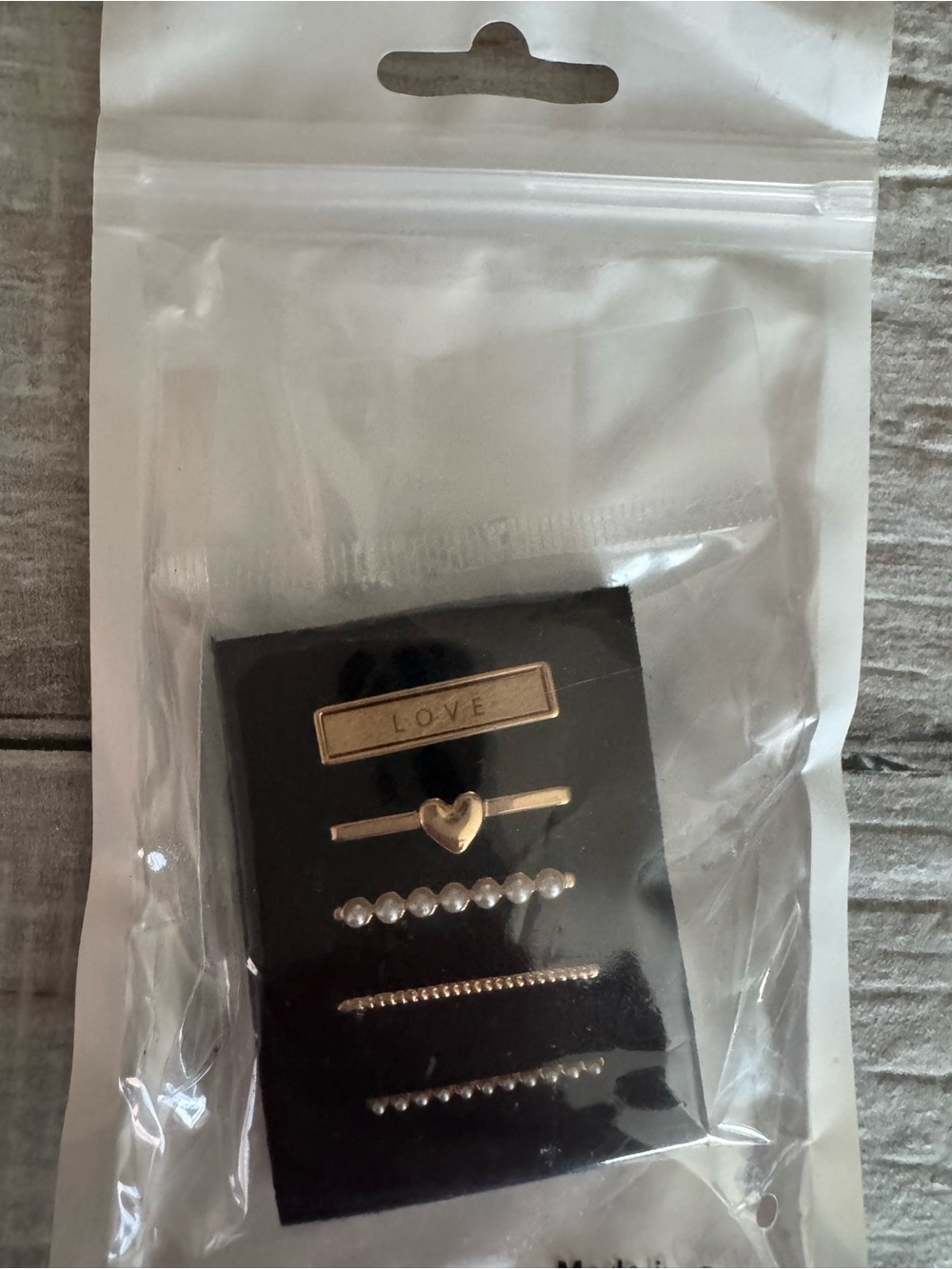 Those are Apple Watch band charms / Apple Watch band decorative pins.